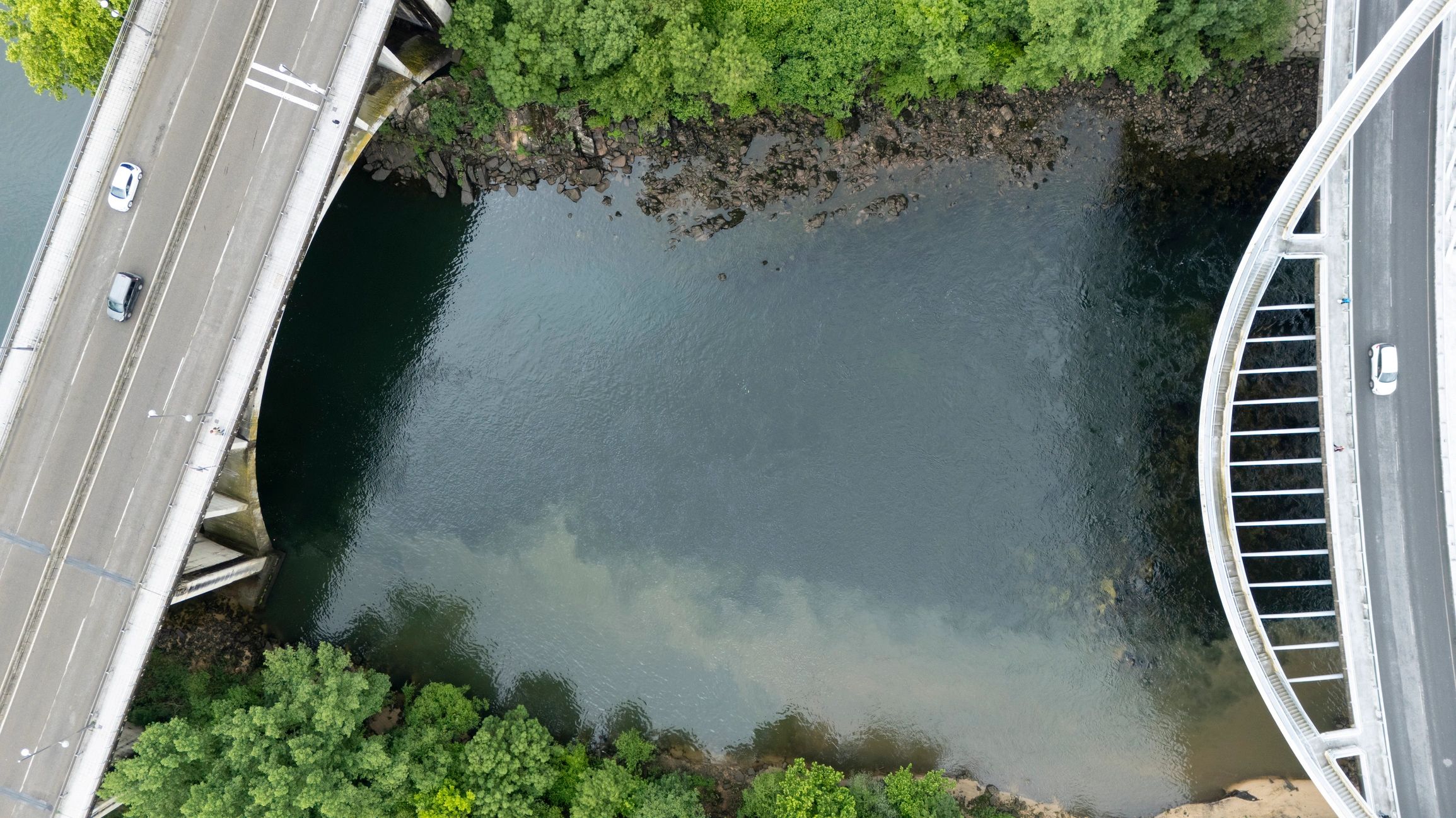 Aerial river crossing through natural landscape